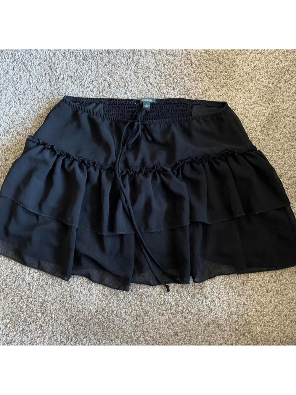 Black mini skirt with ruffled tiers and elastic waistband #mini #ruffles